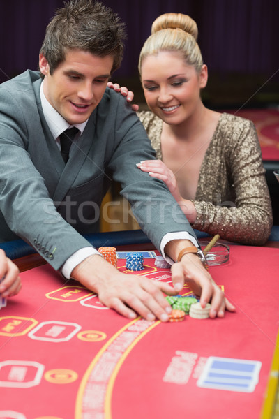Man winning at poker with woman next to him in casino Stock photo © wavebreak_media