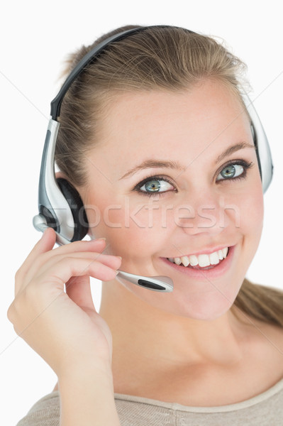 Glimlachende vrouw hoofdtelefoon witte gelukkig werk technologie Stockfoto © wavebreak_media