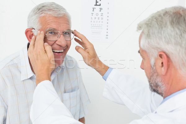 Man wearing glasses after taking vision test at doctor Stock photo © wavebreak_media