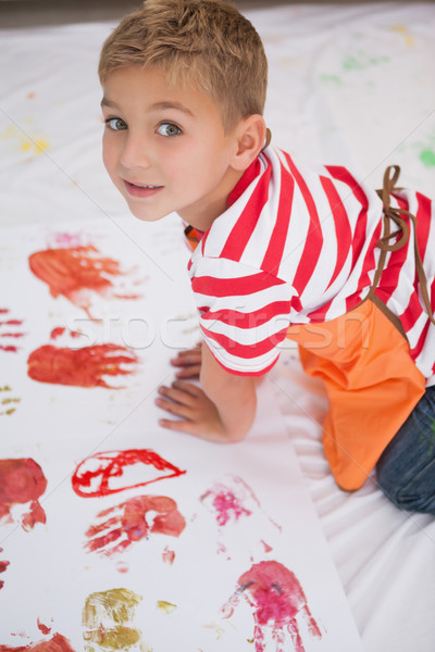 Cute little boy painting on floor in classroom Stock photo © wavebreak_media