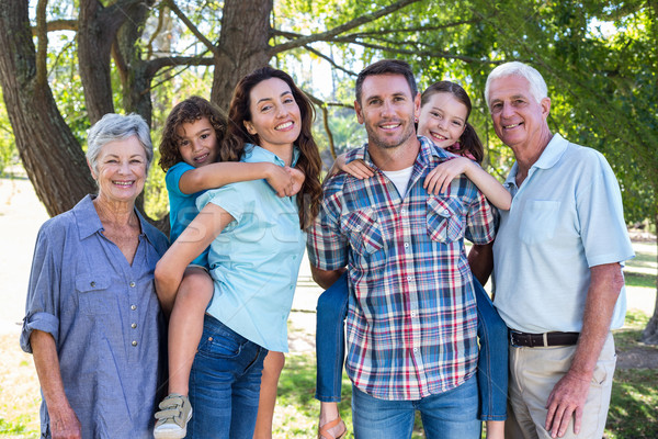 Stock photo: Extended family smiling in the park