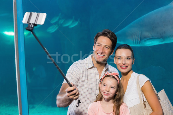 Happy family using selfie stick Stock photo © wavebreak_media