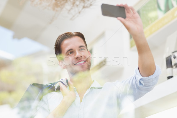 A happy smiling man taking a selfies Stock photo © wavebreak_media