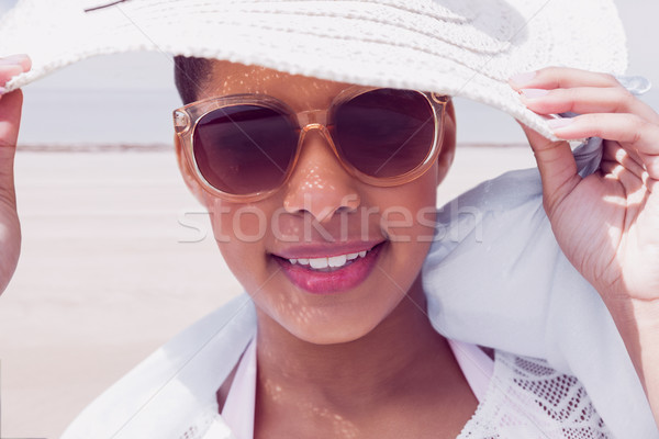 Stylish woman in hat and sunglasses Stock photo © wavebreak_media