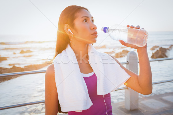 Fit woman resting and drinking water at promenade Stock photo © wavebreak_media