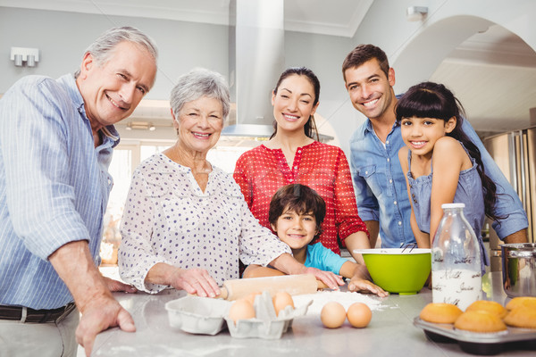 Happy senior woman preparing food with family Stock photo © wavebreak_media