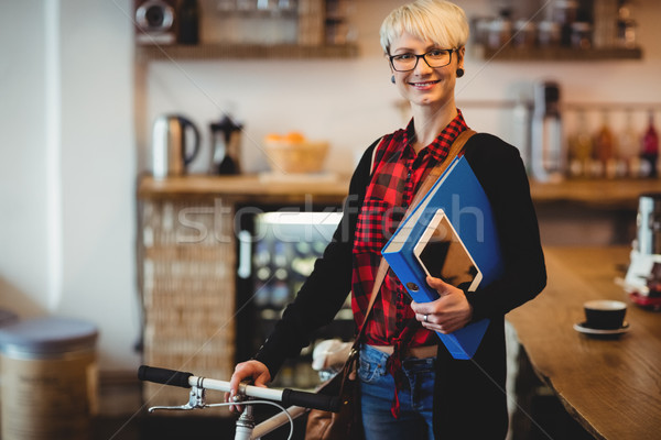 Young woman standing along with bicycle Stock photo © wavebreak_media