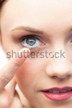 Woman applying contact lens Stock photo © wavebreak_media