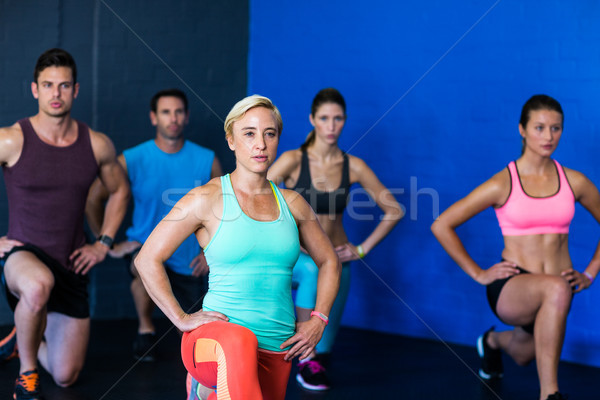 Determined athletes exercising in fitness studio Stock photo © wavebreak_media