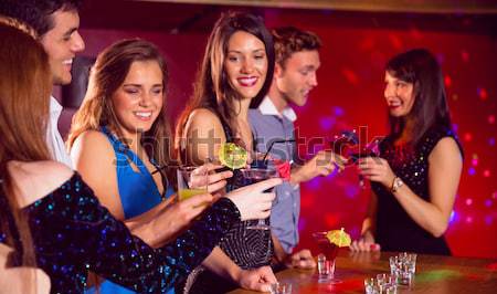 Female friends toasting glasses of cocktail in bar Stock photo © wavebreak_media