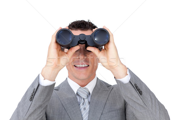 Visionary businessman looking to the future through binoculars  Stock photo © wavebreak_media