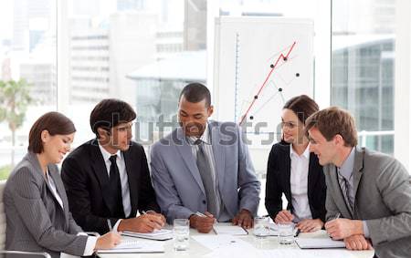 Stock photo: Concentrated manager and his team studying a document