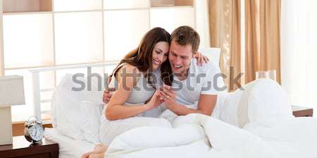 Affectueux couple sur résultats test de grossesse [[stock_photo]] © wavebreak_media