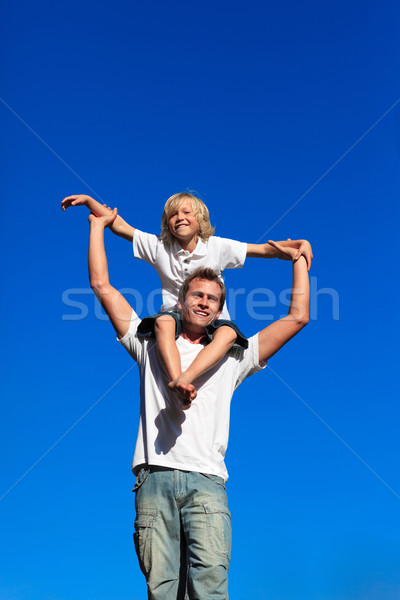 Stock photo: Boy sitting on his father's shoulders