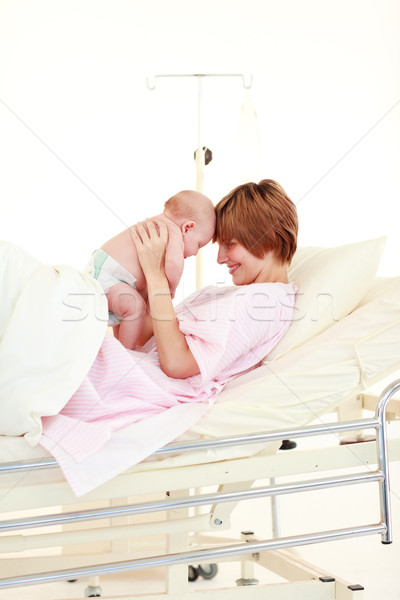 Mother embracing her newborn baby Stock photo © wavebreak_media