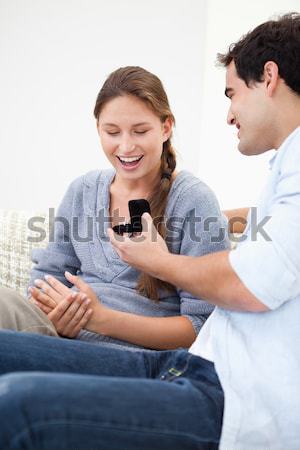 Heureux couple regarder test de grossesse lit maison [[stock_photo]] © wavebreak_media