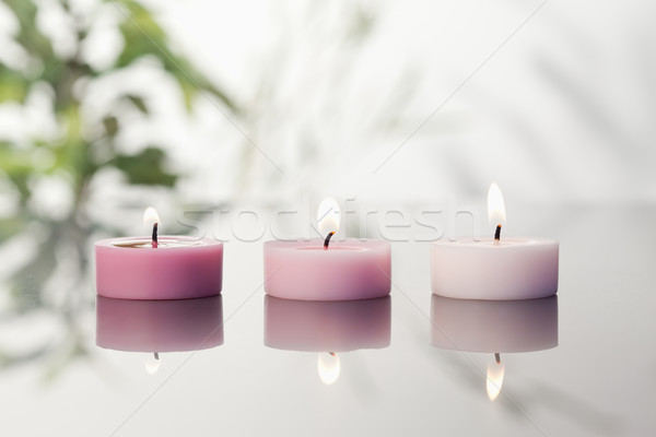 Lighted candles on a mirror Stock photo © wavebreak_media