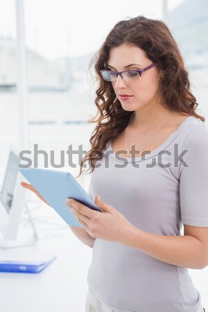 Side view of smiling young woman on her laptop Stock photo © wavebreak_media