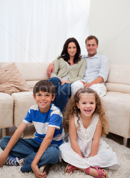 Cheerful family sitting in the living room Stock photo © wavebreak_media