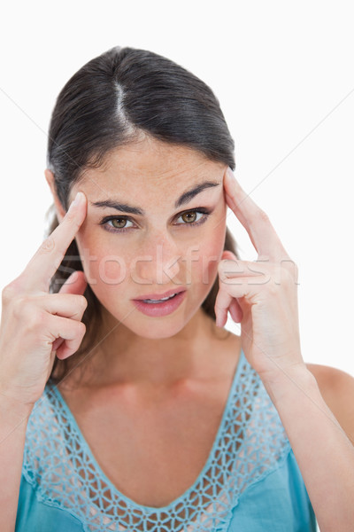 Portrait of a beautiful woman having a headache against a white background Stock photo © wavebreak_media