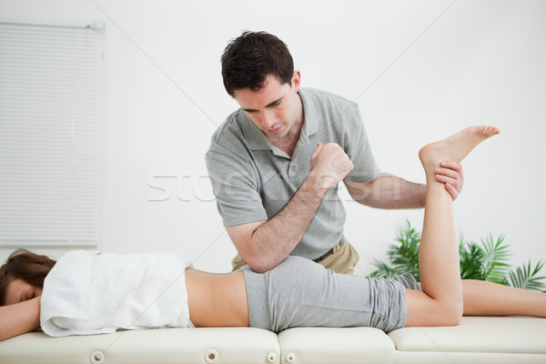 Femme vers l'avant homme jambe chambre [[stock_photo]] © wavebreak_media