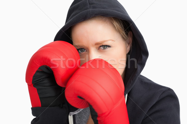 Woman with hoodie boxing against white background Stock photo © wavebreak_media