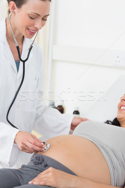 Doctor examining pregnant woman Stock photo © wavebreak_media