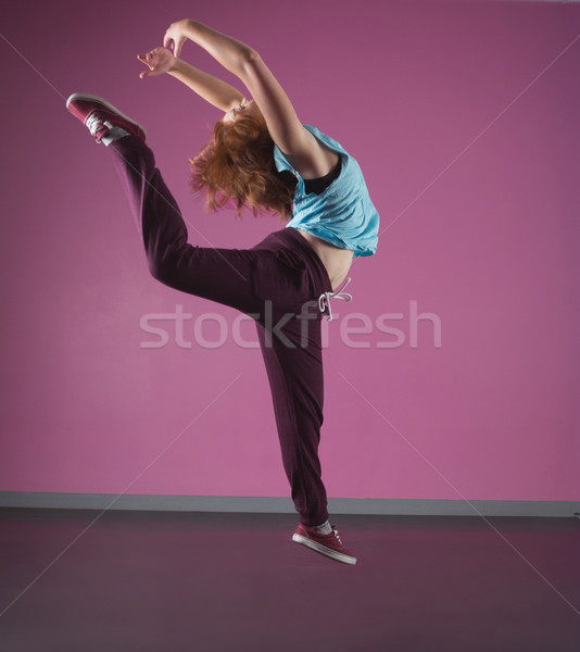 Pretty break dancer leaping mid air Stock photo © wavebreak_media