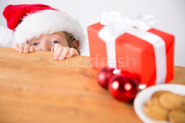Child looking at christmas present Stock photo © wavebreak_media