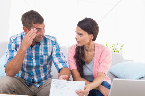 Stock photo: Stressed couple discussing over home finances