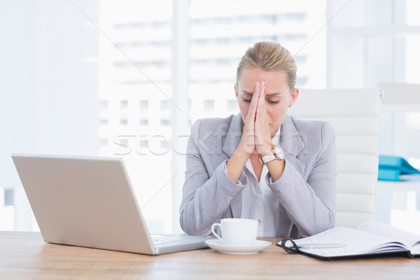 Frustrated businesswoman with head in hands Stock photo © wavebreak_media