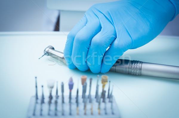 Gloved hand picking dental tools Stock photo © wavebreak_media