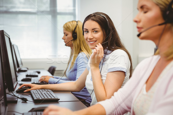 [[stock_photo]]: Souriant · centre · d'appel · agent · parler · casque · bureau