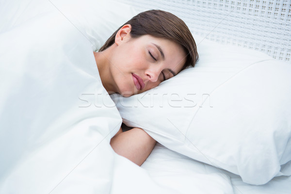 Peaceful brunette sleeping  Stock photo © wavebreak_media