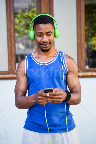  An handsome athlete listening to music Stock photo © wavebreak_media