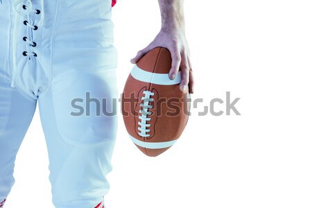Composite image of cropped image of american football player holding ball Stock photo © wavebreak_media