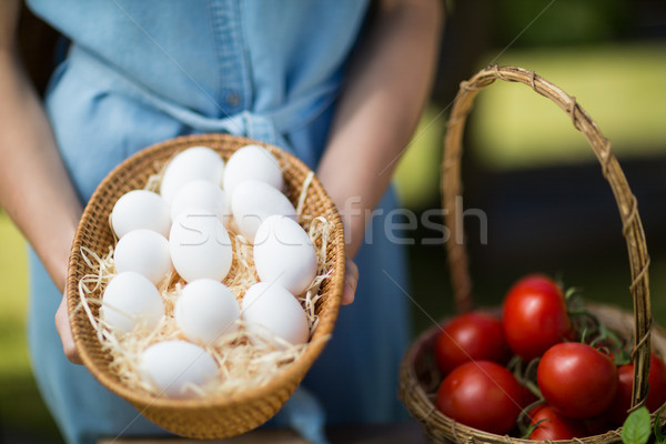 Mid section of woman holding eggs by tomatoes Stock photo © wavebreak_media