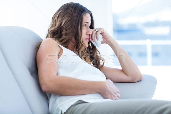 Triste femme enceinte séance canapé maison femme [[stock_photo]] © wavebreak_media