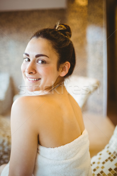 Femme séance vers le bas serviette spa Photo stock © wavebreak_media