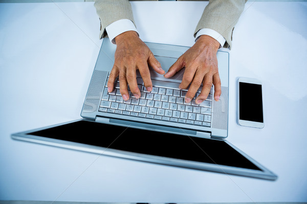 close up view of a businessman using his labtop Stock photo © wavebreak_media
