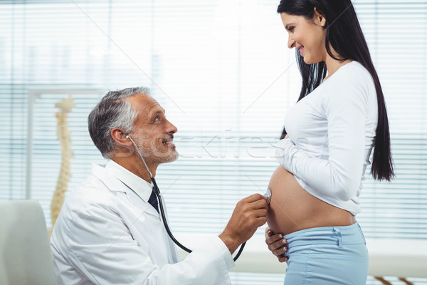 Médecin femme enceinte stéthoscope clinique santé [[stock_photo]] © wavebreak_media