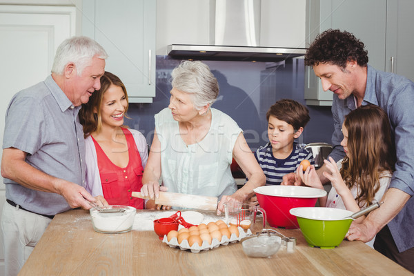 Happy family cooking food in kitchen Stock photo © wavebreak_media