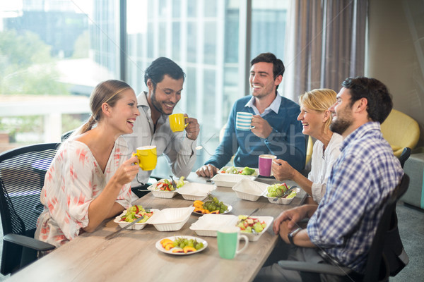 Gente de negocios desayuno oficina hombre mesa beber Foto stock © wavebreak_media