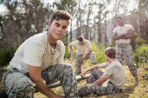 Soldier tying his shoe laces in boot camp Stock photo © wavebreak_media