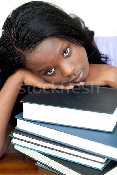 Tired student leaning on a stack of books  Stock photo © wavebreak_media