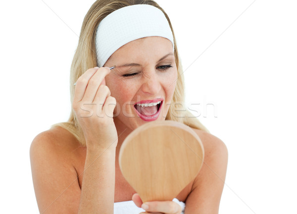 Blond woman using tweezers Stock photo © wavebreak_media