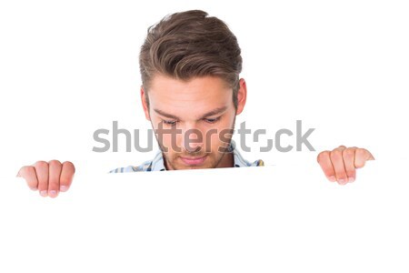 Caucasian male cook holding a placard against white background Stock photo © wavebreak_media