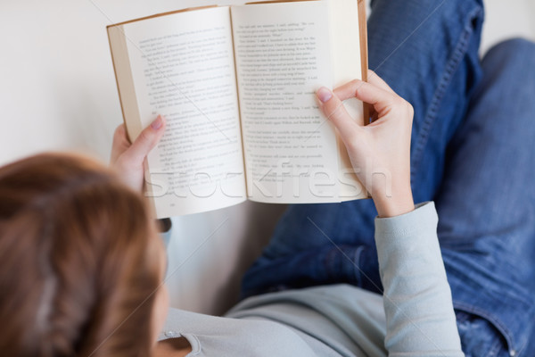 Shadowing young woman reading on the sofa Stock photo © wavebreak_media