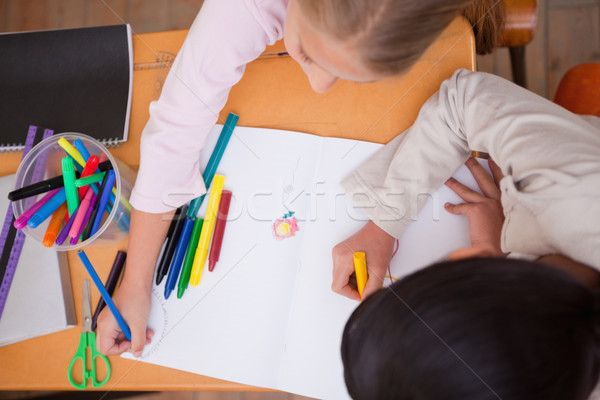 Above view of schoolgirls drawing in a classroom Stock photo © wavebreak_media