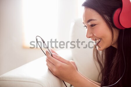 Girl at the kitchen table looking at tablet Stock photo © wavebreak_media